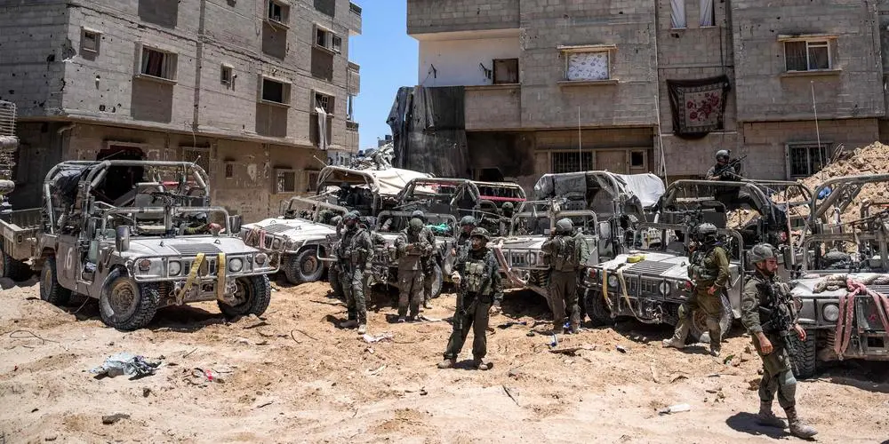 Israeli soldiers are seen during a ground operation in the southern Gaza Strip on July 3, 2024. The Israeli military invited reporters for a tour of Rafah, where the military has been operating since May 6. (Photo by Ohad Zwigenberg / POOL / AFP)